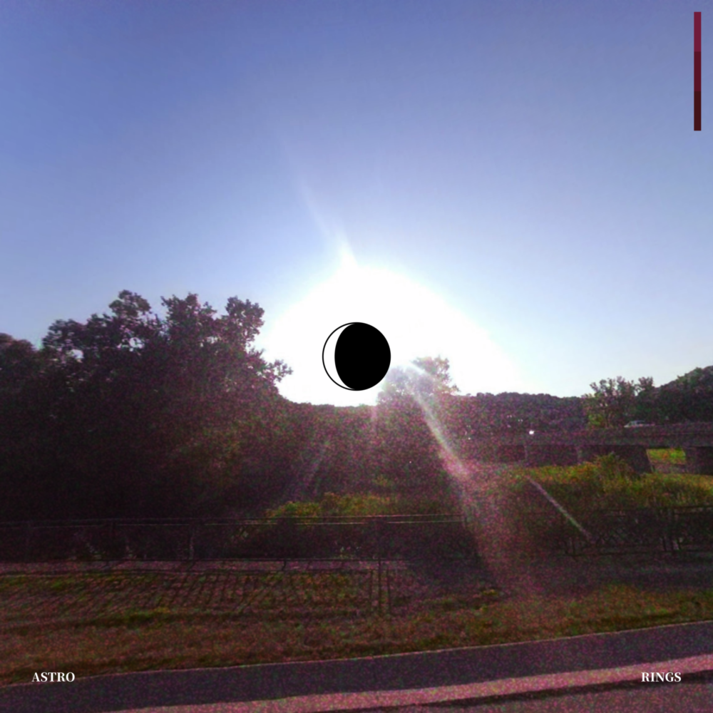 A grainy photograph overlooking a bridge and some trees, with the camera pointed straight at the sun. A graphic of a waxing gibbous moon is in the center.